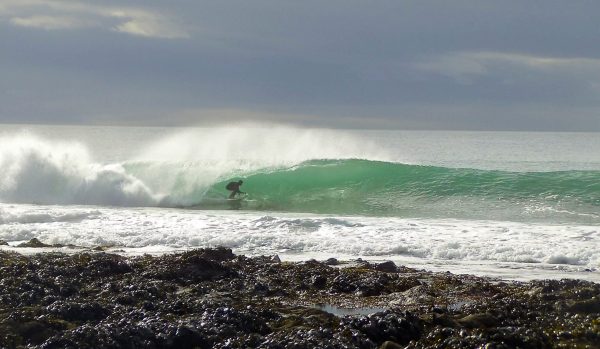 Steve surfing in Cornwall in the yellow fins