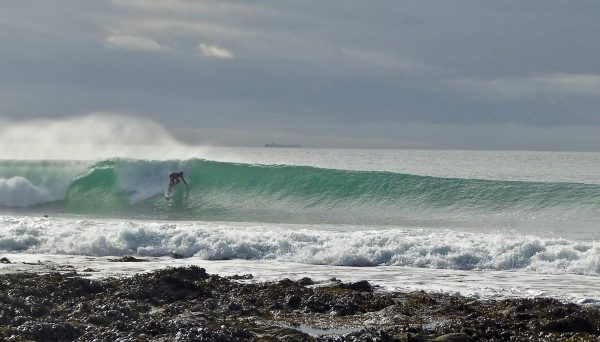 Steve surfing in Cornwall in the yellow fins