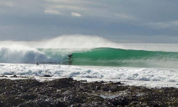 Steve surfing in Cornwall in the yellow fins