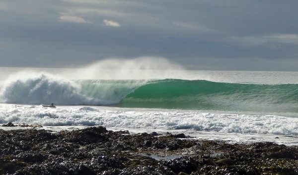Steve surfing in Cornwall in the yellow fins